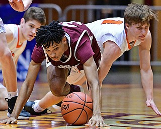 CANTON, OHIO - MARCH 7, 2019: Boardman's Dacone Martin, left, and Green's Shea Simmer crawl for a loose ball during the first half of their OHSAA Tournament game, Thursday night at the Canton Civic Center. DAVID DERMER | THE VINDICATOR