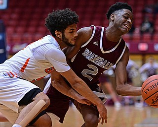 CANTON, OHIO - MARCH 7, 2019: Boardman's Che Trevena collides with Green's Kaleb Martinduring the first half of their OHSAA Tournament game, Thursday night at the Canton Civic Center. DAVID DERMER | THE VINDICATOR