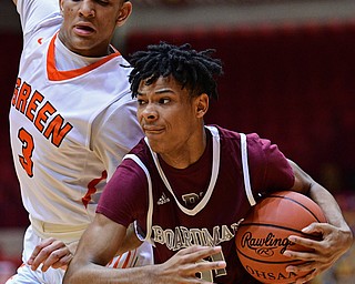 CANTON, OHIO - MARCH 7, 2019: Boardman's Dacone Martin drives on Green's Trey Martin during the first half of their OHSAA Tournament game, Thursday night at the Canton Civic Center. DAVID DERMER | THE VINDICATOR
