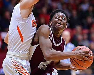 CANTON, OHIO - MARCH 7, 2019: Boardman's Che Trevena goes to the basket against Green's Shea Simmer during the first half of their OHSAA Tournament game, Thursday night at the Canton Civic Center. DAVID DERMER | THE VINDICATOR