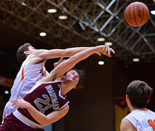 CANTON, OHIO - MARCH 7, 2019: Boardman's Cam Creps knocks the ball away from Green's Alex Casper during the second half of their OHSAA Tournament game, Thursday night at the Canton Civic Center. DAVID DERMER | THE VINDICATOR