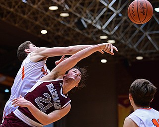 CANTON, OHIO - MARCH 7, 2019: Boardman's Cam Creps knocks the ball away from Green's Alex Casper during the second half of their OHSAA Tournament game, Thursday night at the Canton Civic Center. DAVID DERMER | THE VINDICATOR