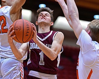 CANTON, OHIO - MARCH 7, 2019: Boardman's Tommy Fryda goes between Green's Donovan O'Neil, left, and Zack Oddo during the second half of their OHSAA Tournament game, Thursday night at the Canton Civic Center. DAVID DERMER | THE VINDICATOR