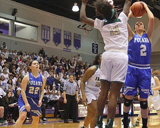 William D. Lewis The Vindicator  Poland's Sarah Bury(2) shoots past Akron SVSM 's Jada Haines at Barberton 3-8-19.