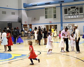 Fathers and daughters dance during the Youngstown City School District father-daughter dance at East High School on Friday night. EMILY MATTHEWS | THE VINDICATOR