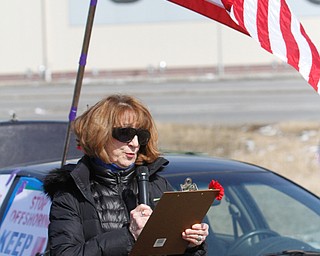  ROBERT K.YOSAY  | THE VINDICATOR..Werner Lange, the guy who held the 43 day vigil outside the plant, is having an outdoor tribute to women workers and a Òprotest against the gross injustice of idling of this plant.Ó..Roxanne Lange reads a statement on International Womens day