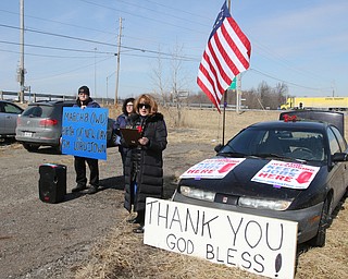  ROBERT K.YOSAY  | THE VINDICATOR..Werner Lange, the guy who held the 43 day vigil outside the plant, is having an outdoor tribute to women workers and a Òprotest against the gross injustice of idling of this plant.Ó..Werner Lange- Sherry Farley of fowler- nd Charmaine Reiter of Austintown  listen to Roxanne Lange as she talks about INternational Womens day