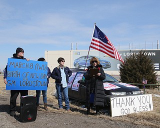  ROBERT K.YOSAY  | THE VINDICATOR..Werner Lange, the guy who held the 43 day vigil outside the plant, is having an outdoor tribute to women workers and a Òprotest against the gross injustice of idling of this plant.Ó..Werner Lange- Sherry Farley of fowler- (hidden)-and Charmaine Reiter of Austintown  listen to Roxanne Lange as she talks about INternational Womens day