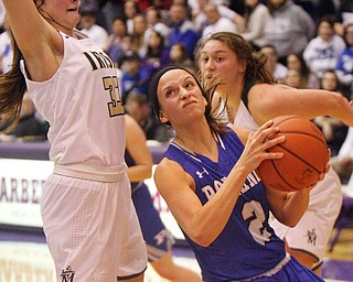 William D. Lewis The Vindicator  Poland's Sarah Bury(2)drives around  Akron SVSM's Annie Watson(33) at Barberton 3-8-19.