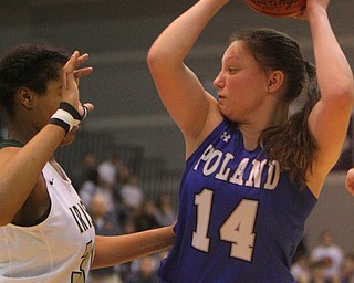 William D. Lewis The Vindicator  Poland's Kailyn Brown(14) keeps the ball from Akron SVSM Sophia Williams(32) at Barberton 3-8-19.