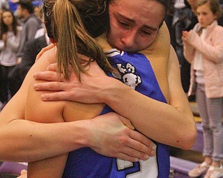 William D. Lewis The Vindicator  Poland's Sarah Bury(2) hugs Jackie Grisdale)21) after loss to Akron SVSM at Barberton 3-8-19.