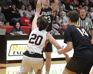 Cole Bunofsky (23) of Lowellville goes up for a shot over Beau Brungard (20) of Springfield during Friday nights district championship game at Struthers High School.  Dustin Livesay  |  The Vindicator  3/8/19  Struthers