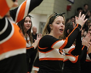 Springfield cheerleader Savannah Sheely celebrates as the Tigers take a lead late in the fourth quarter during Friday nights district championship game against Lowellville at Struthers High School.  Dustin Livesay  |  The Vindicator  3/8/19  Struthers