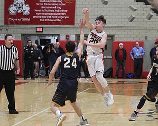 Beau Brungard (20) of Springfield passes the ball over Lowellville’s Joe Ballone (24) during Friday nights district championship game at Struthers High School.  Dustin Livesay  |  The Vindicator  3/8/19  Struthers