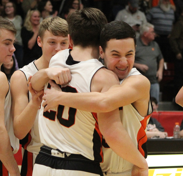 Lukas Yemma (3) of Springfield hugs Beau Brungard as time ran out during Friday nights district championship game at Struthers High School giving them the win over Lowellville.  Dustin Livesay  |  The Vindicator  3/8/19  Struthers