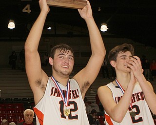 Springfield senior Shane Eynon (12) holds up the championship trophy to the crowd at Struthers.  Dustin Livesay  |  The Vindicator  3/8/19  Struthers