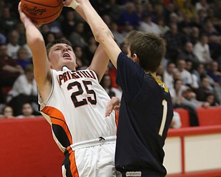 Adam Wharry (25) of Springfield puts up a shot while being closely defended by Lowellvilleâ€™s Micah Mamula Zarlingo (1) during Friday nights district championship game at Struthers High School.  Dustin Livesay  |  The Vindicator  3/8/19  Struthers