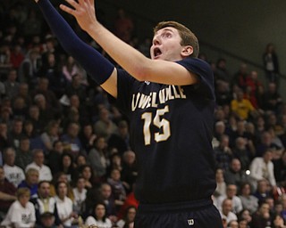 Lowellvilleâ€™s Jake Rotz puts in a layup over Evan Ohlin of Springfield during  Friday nights district championship game at Struthers High School.  Dustin Livesay  |  The Vindicator  3/8/19  Struthers