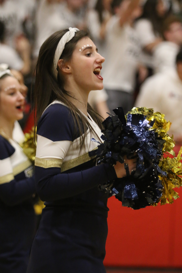 Lowellville cheerleader Chloe Simmerman celebrates a Rocket 3-pointer during the third period of Friday nights district championship game at Struthers High School.  Dustin Livesay  |  The Vindicator  3/8/19  Struthers