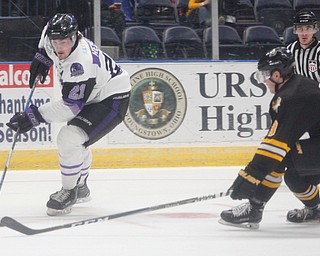 Phantoms' Brett Murray gets ready to pass the puck while Gamblers' Jarod Crespo tries to block him during their game at Covelli Centre on Saturday night. EMILY MATTHEWS | THE VINDICATOR
