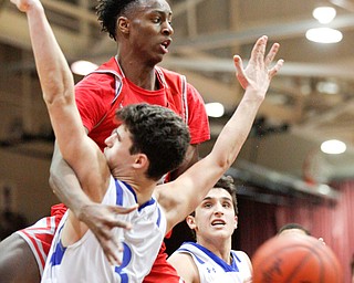 Chaney's William Brown loses control of the ball as he collides with Poland's Braeden O'Shaughnessy during their game at Boardman High School on Saturday. EMILY MATTHEWS | THE VINDICATOR