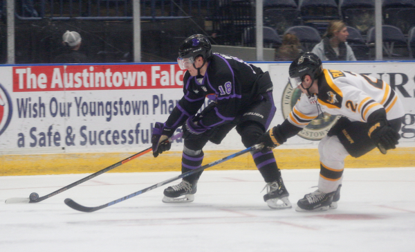 The Phantoms' Jack Malone tries to keep the puck from the Gamblers' Chase Pilawski during their game in Covelli Centre on Sunday. EMILY MATTHEWS | THE VINDICATOR