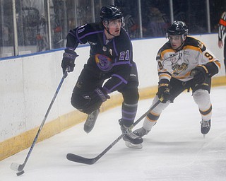 The Phantoms' Brett Murray takes the puck behind the net as he tries to keep it from the Gamblers' Tyler Spott during their game in Covelli Centre on Sunday. EMILY MATTHEWS | THE VINDICATOR