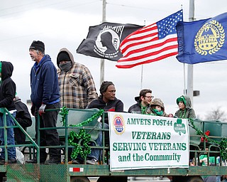 Members of the AMVETS Post 44 ride in the Mahoning Valley St. Patrick's Day Parade in Boardman on Sunday afternoon. EMILY MATTHEWS | THE VINDICATOR