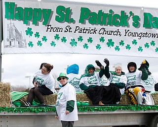 People with St. Patrick Church ride and walk in the Mahoning Valley St. Patrick's Day Parade in Boardman on Sunday afternoon. EMILY MATTHEWS | THE VINDICATOR