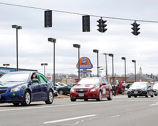 Chevrolets drive in the Mahoning Valley St. Patrick's Day Parade in Boardman on Sunday afternoon. EMILY MATTHEWS | THE VINDICATOR