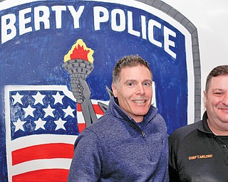 Pastor Mike Constantino, left, of New Life Church on Tibbetts Wick Road and Liberty Police Chief Toby Meloro post at the Liberty Police Department. Constantino is one of the volunteer chaplains for the new program that Liberty established.