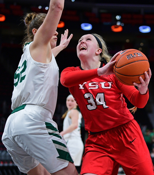DETROIT, MICHIGAN - MARCH 11, 2019: Youngstown State's McKenah Peters goes to the basket against Green Bay's Madison Wolf during the second half of their Horizon League Tournament game, Monday afternoon at Little Caesars Arena. Green Bay won 55-53. DAVID DERMER | THE VINDICATOR