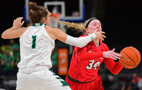 DETROIT, MICHIGAN - MARCH 11, 2019: Youngstown State's McKenah Peters is bumped by Green Bay's Jen Wellnitz during the second half of their Horizon League Tournament game, Monday afternoon at Little Caesars Arena. Green Bay won 55-53. DAVID DERMER | THE VINDICATOR
