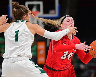 DETROIT, MICHIGAN - MARCH 11, 2019: Youngstown State's McKenah Peters is bumped by Green Bay's Jen Wellnitz during the second half of their Horizon League Tournament game, Monday afternoon at Little Caesars Arena. Green Bay won 55-53. DAVID DERMER | THE VINDICATOR