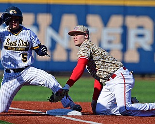 KENT, OHIO - MARCH 12, 2019: Youngstown State's Blaze Glenn, right, looks to the umpire after unsuccessfully tagging out Kent State's Greg Lewandoski during the first inning of their game, Tuesday afternoon at Kent State. Kent State won 10-5. DAVID DERMER | THE VINDICATOR