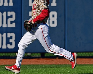 KENT, OHIO - MARCH 12, 2019: Youngstown State's Jeff Wehler chases down a ball hit by Kent State's Ben Carew in the 4th inning of their game, Tuesday afternoon at Kent State. Kent State won 10-5. DAVID DERMER | THE VINDICATOR