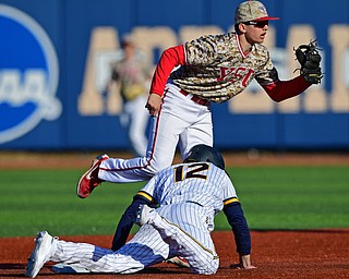 KENT, OHIO - MARCH 12, 2019: Youngstown State's Phillip Glasser shows the ball to the umpire after an unsuccessful pickoff attempt of Kent State's Ben Carew in the 4th inning of their game, Tuesday afternoon at Kent State. Kent State won 10-5. DAVID DERMER | THE VINDICATOR