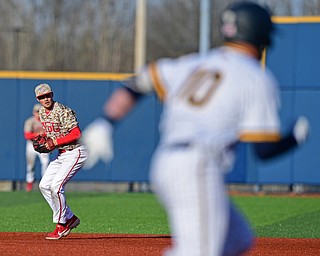 KENT, OHIO - MARCH 12, 2019: Youngstown State's Cody Dennis throws to first to force out Kent State's Kian O'Brien in the 5th inning of their game, Tuesday afternoon at Kent State. Kent State won 10-5. DAVID DERMER | THE VINDICATOR