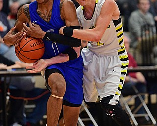 CANTON, OHIO - MARCH 12, 2019: Richmond Heights' Curtis Houston II rips the ball away from Bristol's Gage Elza during the second half of their game, Tuesday night at the Canton. Richmond Heights won 66-34. DAVID DERMER | THE VINDICATOR