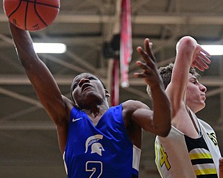 CANTON, OHIO - MARCH 12, 2019: Richmond Heights' Jevontae Jones grabs a rebound away from Bristol's Matt Church during the second half of their game, Tuesday night at the Canton. Richmond Heights won 66-34. DAVID DERMER | THE VINDICATOR