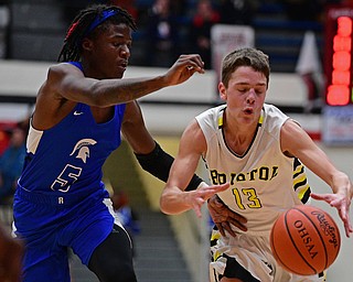 CANTON, OHIO - MARCH 12, 2019: Bristol's Mick Wiebe dribbles while being pressured by Richmond Heights' Bj Carter during the second half of their game, Tuesday night at the Canton. Richmond Heights won 66-34. DAVID DERMER | THE VINDICATOR