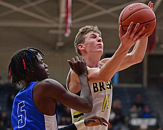 CANTON, OHIO - MARCH 12, 2019: Bristol's Matt Church goes to the basket against Richmond Heights' Bj Carter during the second half of their game, Tuesday night at the Canton. Richmond Heights won 66-34. DAVID DERMER | THE VINDICATOR