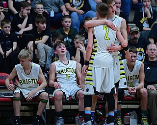 CANTON, OHIO - MARCH 12, 2019: Bristol's Matt Church, back, hugs Gage Elza during the second half of their game, Tuesday night at the Canton. Richmond Heights won 66-34. DAVID DERMER | THE VINDICATOR