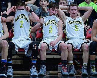 CANTON, OHIO - MARCH 12, 2019: (LtoR) Bristol's Gage Elza, Matt Stephens and Damion Durst sit on the bench after being removed from the game during the second half of their game, Tuesday night at the Canton. Richmond Heights won 66-34. DAVID DERMER | THE VINDICATOR