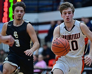 CANTON, OHIO - MARCH 12, 2019: Springfield's Clay Medvec dribbles ahead of South Central's Alex Holland during the second half of their game, Tuesday night at the Canton Fieldhouse. DAVID DERMER | THE VINDICATOR