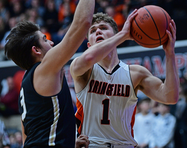 CANTON, OHIO - MARCH 12, 2019: Springfield's Evan Ohlin goes to the basket against South Central's Alex Holland during the second half of their game, Tuesday night at the Canton Fieldhouse. DAVID DERMER | THE VINDICATOR