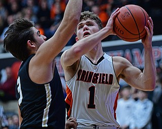 CANTON, OHIO - MARCH 12, 2019: Springfield's Evan Ohlin goes to the basket against South Central's Alex Holland during the second half of their game, Tuesday night at the Canton Fieldhouse. DAVID DERMER | THE VINDICATOR