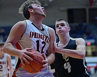 CANTON, OHIO - MARCH 12, 2019: Springfield's Shane Eynon goes to the basket against South Central's David Lamoreaux during the second half of their game, Tuesday night at the Canton Fieldhouse. DAVID DERMER | THE VINDICATOR