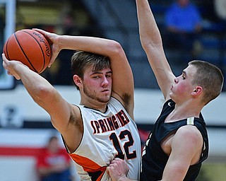 CANTON, OHIO - MARCH 12, 2019: Springfield's Shane Eynon looks to pass while being pressured by South Central's David Lamoreaux during the second half of their game, Tuesday night at the Canton Fieldhouse. DAVID DERMER | THE VINDICATOR