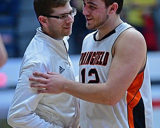 CANTON, OHIO - MARCH 12, 2019: Springfield's Shane Eynon is congratulated by head coach Steve French after being removed from the game during the second half of their game, Tuesday night at the Canton Fieldhouse. DAVID DERMER | THE VINDICATOR